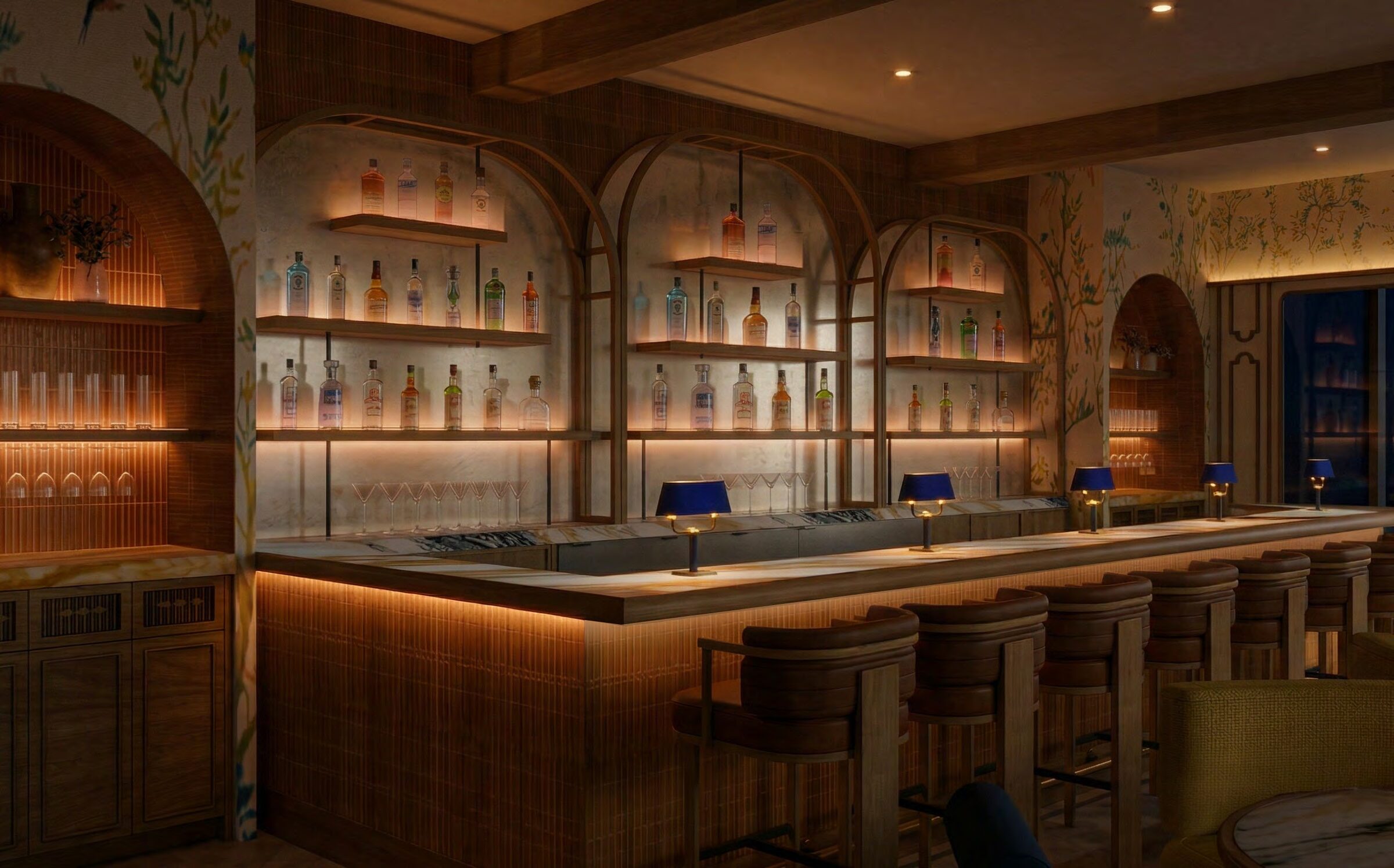 The bar, with cobalt counter lamps along the marble top