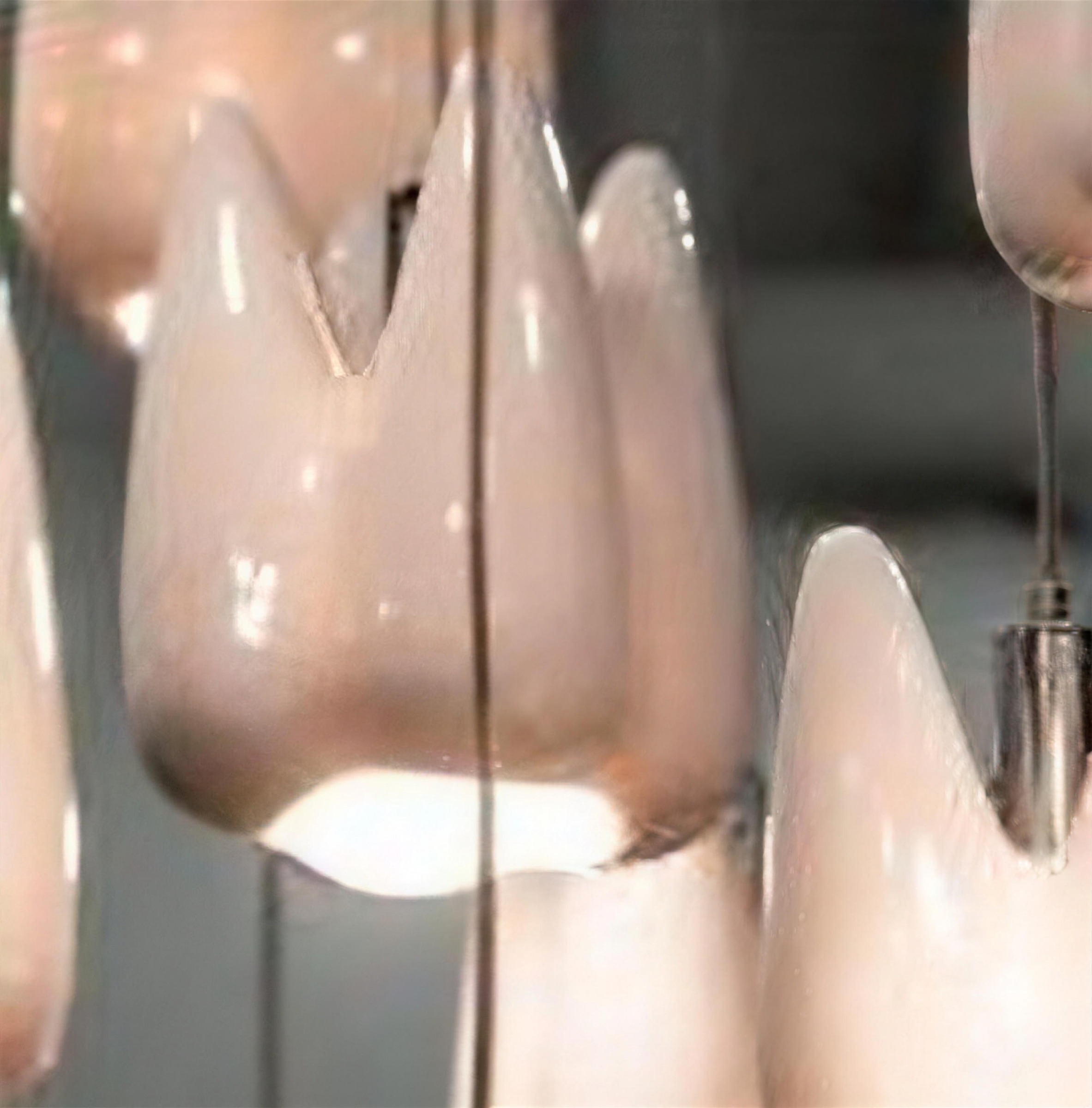 The upper tier of tooth pendants