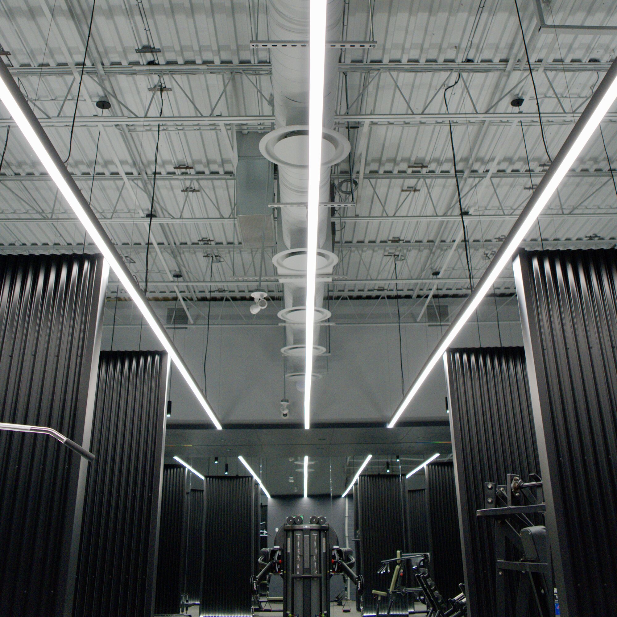 Linear ceiling runs leading down the training hall