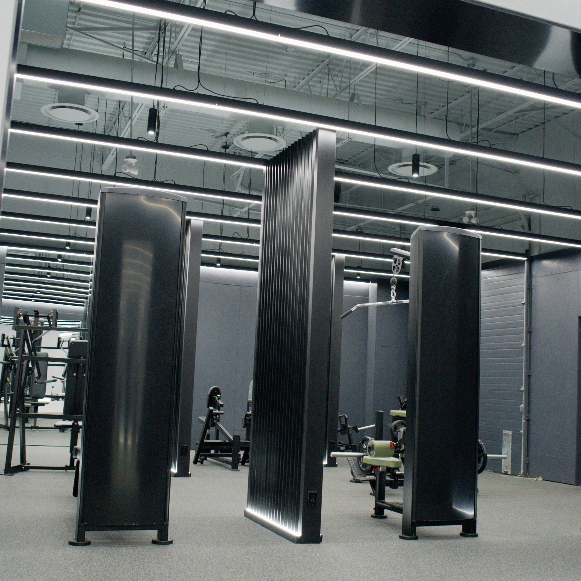 Training equipment between backlit fluted columns