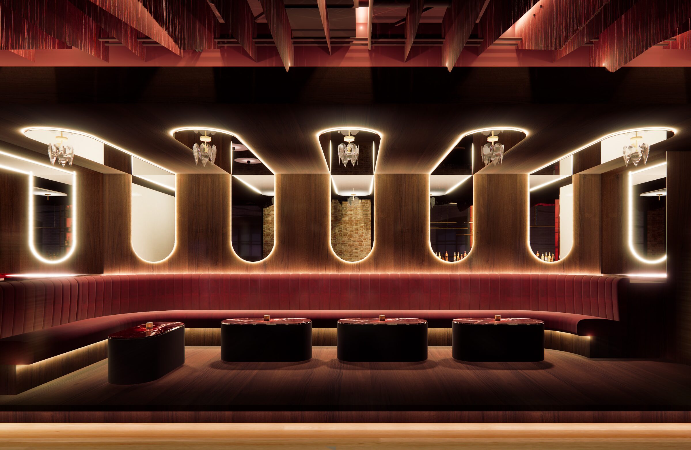 The mirror cove: arched mirrors outlined in warm light above red banquettes