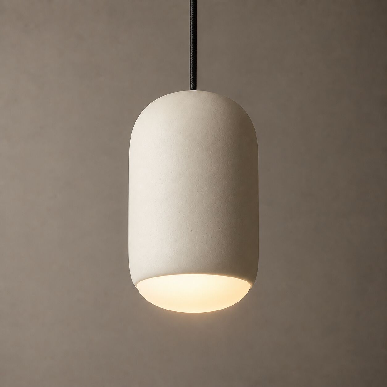 Ova Giu: a single capsule pendant casting light downward