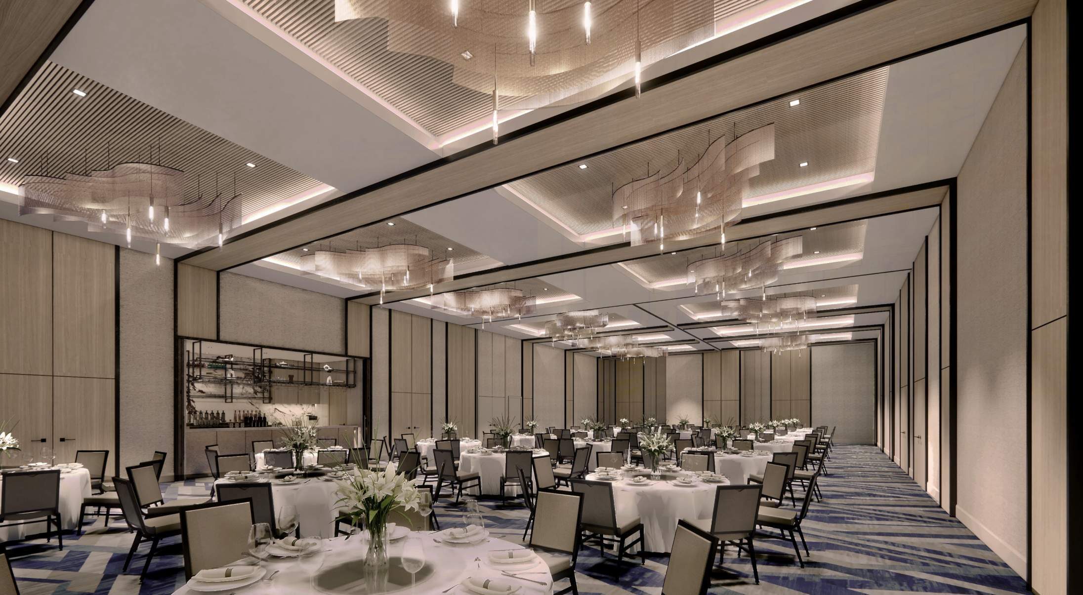 The ballroom set for dinner under linear and decorative ceiling lights