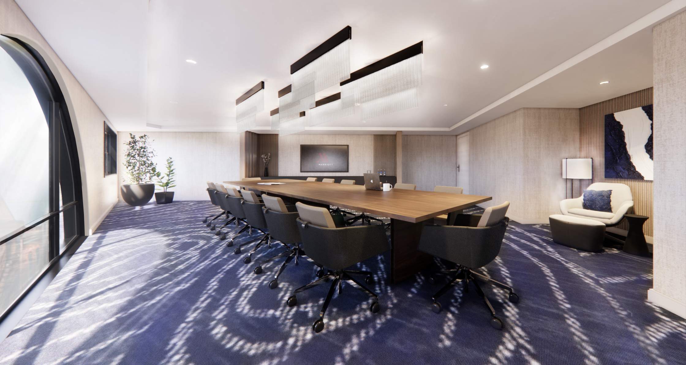 Meeting room with suspended linear fixtures over a long table