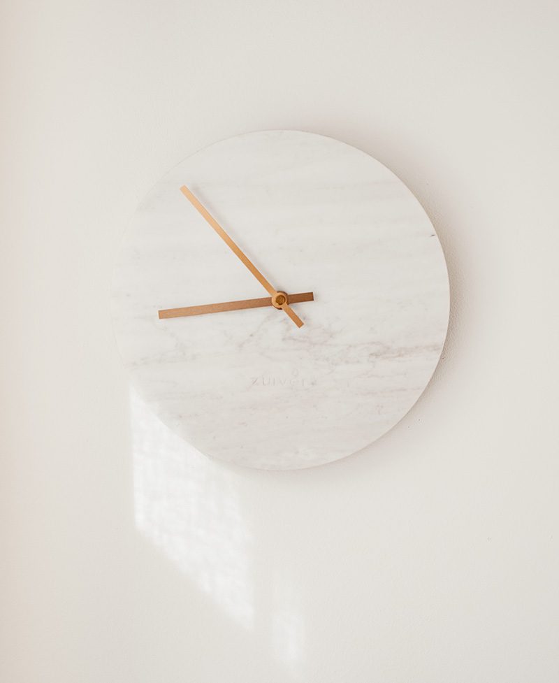 A clock is mounted on the wall with no hands.