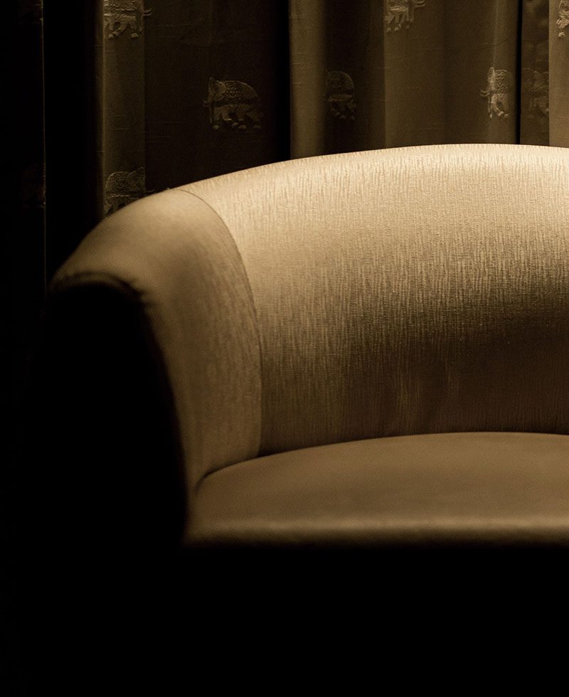 A close up of the arm rest on a couch