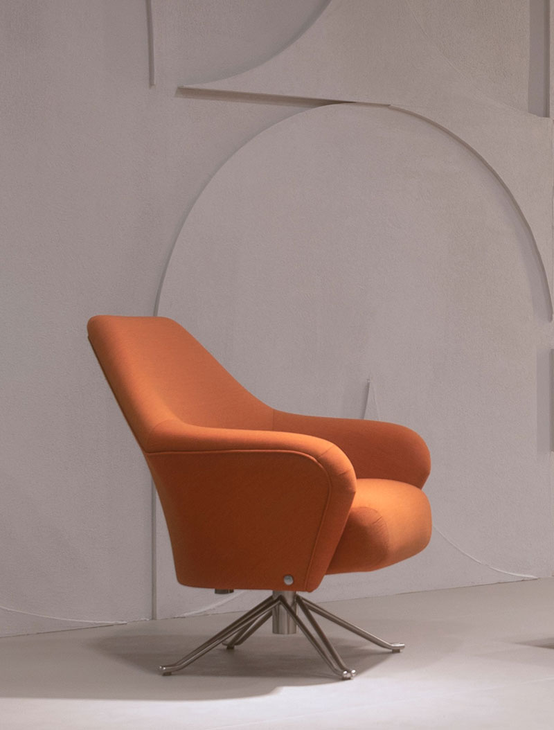 A chair with an orange seat and back.