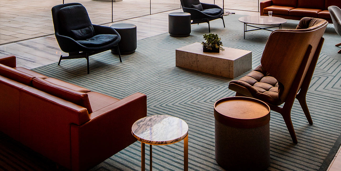 A room with several different chairs and tables.